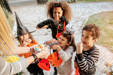 Children in Halloween costumes, trick or treating 