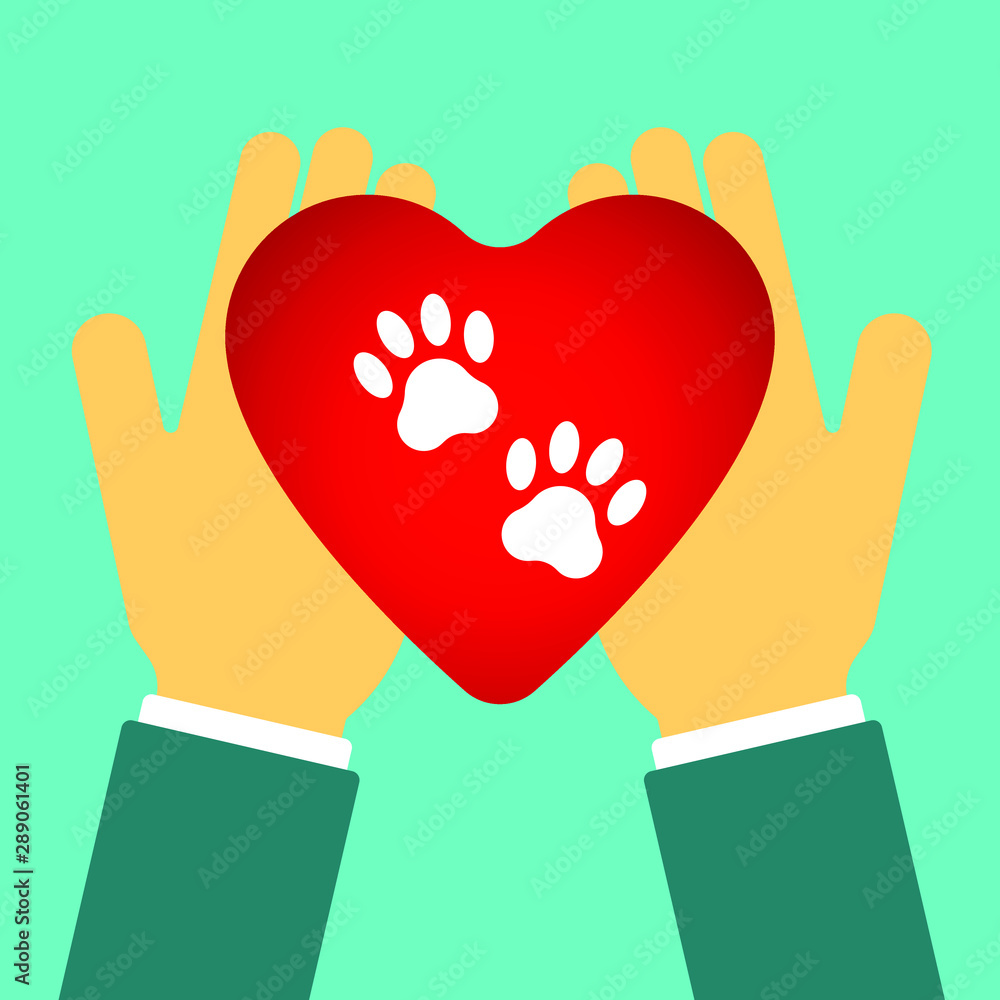Obraz premium Heart with the image of paw prints. Heart in hands. Logo for pet shop or for veterinary clinic.