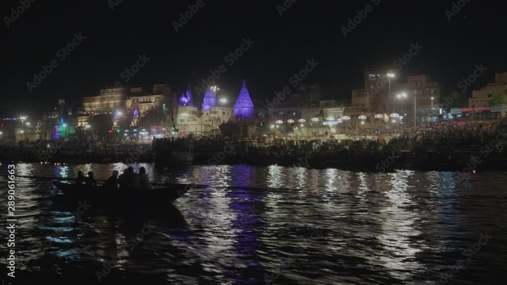 Crowds Of People At The Holy Ceremony Held At The Ghats In Varanasi Viewing By Boat On The Ganges River Crowds Of People At The Holy Ceremony Held At The Ghats In Varanasi Viewing By Boat On The Ganges River