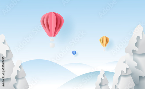 3D Scenery balloons fly air on holidays blue sky background with winter snowflakes season forest.Creative minimal paper cut and craft style.Christmas and happy new year.vector illustration EPS10