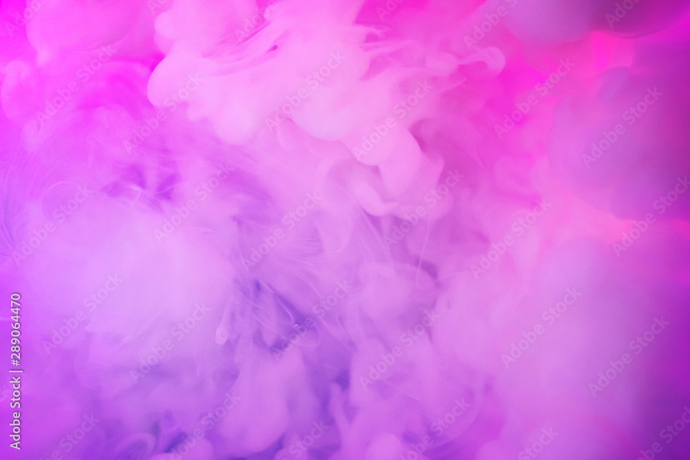 Paints dissolved in water with a beautiful spectacular blur. Trending neon purple colors. Bright amazing abstract background. Smoke effect. Paints dissolved in water with a beautiful spectacular blur. Trending neon purple colors. Bright amazing abstract background. Smoke effect.