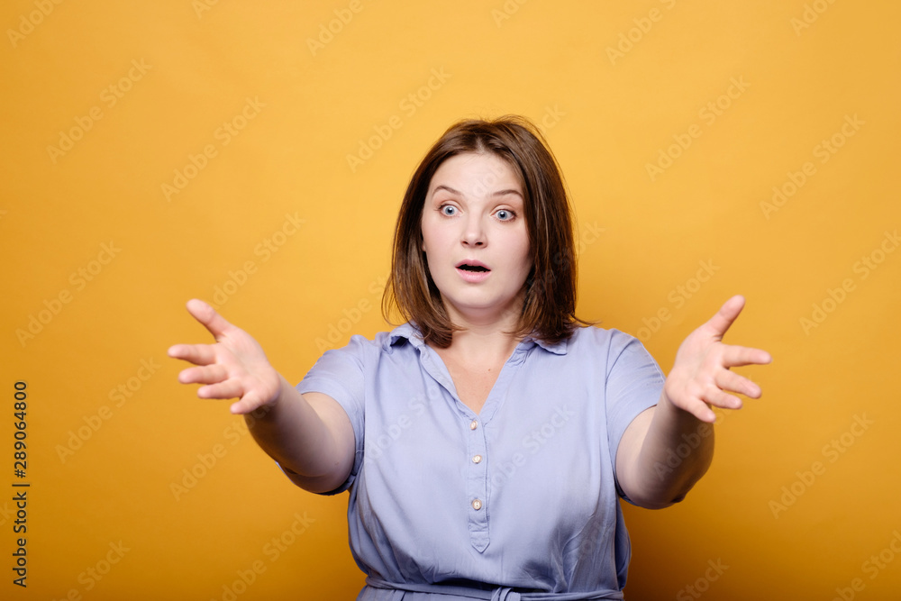 emotional plus size model on a yellow background emotional plus size model on a yellow background