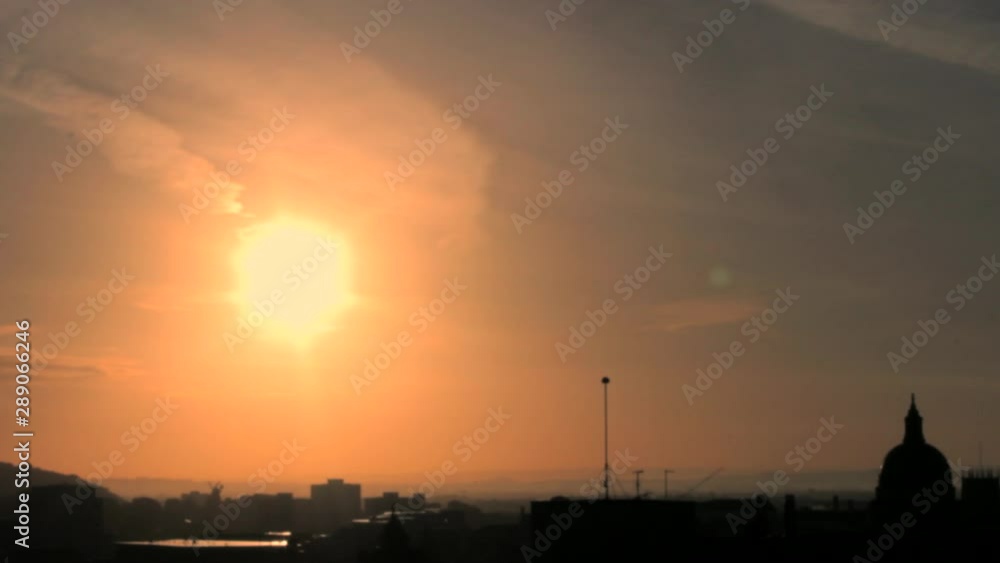 Beautiful Sunset Over The City With The Burning Orange Sun With Birds Flying By Beautiful Sunset Over The City With The Burning Orange Sun With Birds Flying By