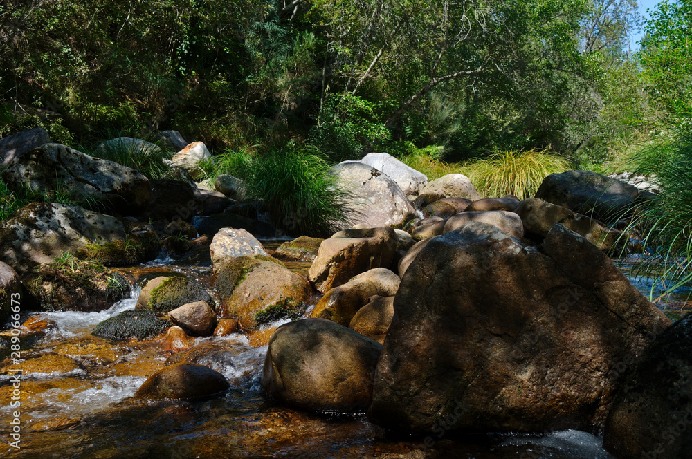 River flow through the rocks in Carvalhais. Sao Pedro do Sul, Portugal River flow through the rocks in Carvalhais. Sao Pedro do Sul, Portugal