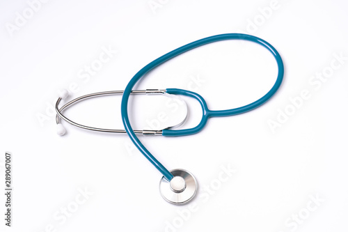 Green stethoscope, object of doctor equipment, isolated on white background. Medical design concept, cut out, clipping path, top view, studio shot.