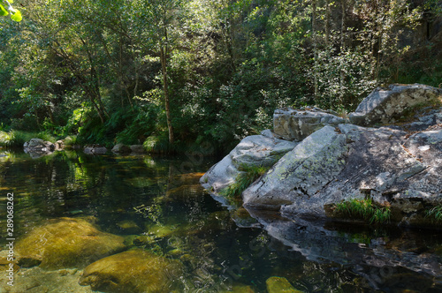Peaceful river waters in the forests of Carvalhais. Sao Pedro do Sul, Portugal