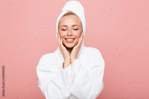 Arttractive young woman wearing bathrobe and towel