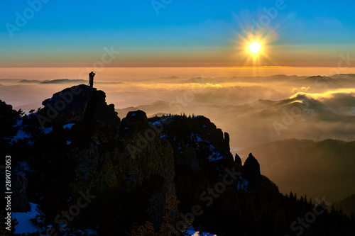 Aerial Landscape view from Ceahl  u Mountains National Park at sunset in winter season Sunset in Ceahlau Mountains