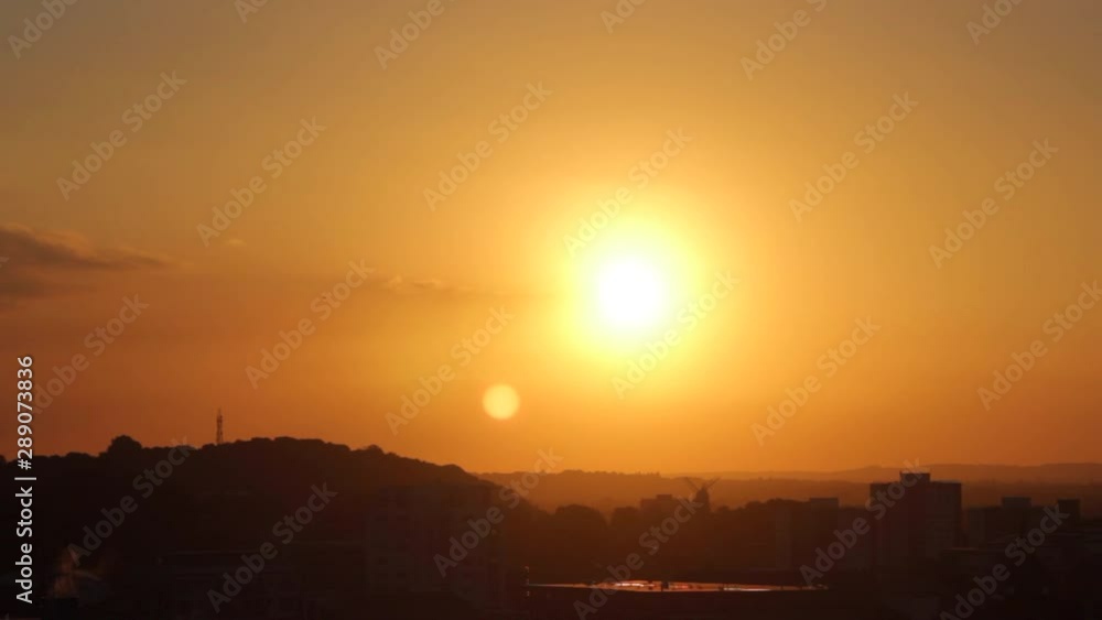 Beautiful Sunset Over The City With The Burning Orange Sun With Birds Flying Over The Beautiful Sk Beautiful Sunset Over The City With The Burning Orange Sun With Birds Flying Over The Beautiful Sk