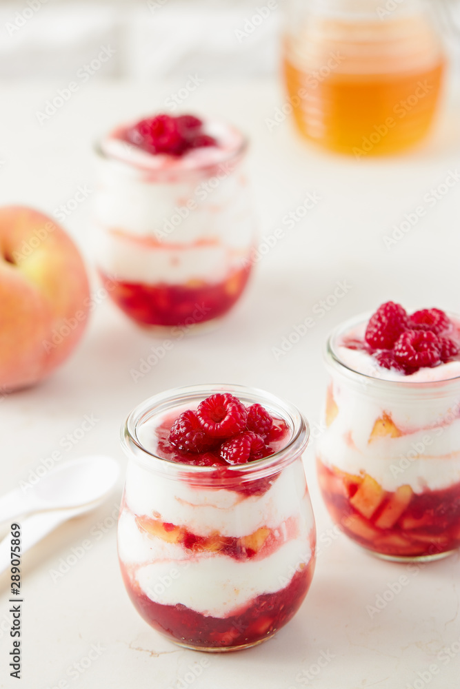 Peach and raspberry dessert with yogurt cream Peach and raspberry dessert with yogurt cream