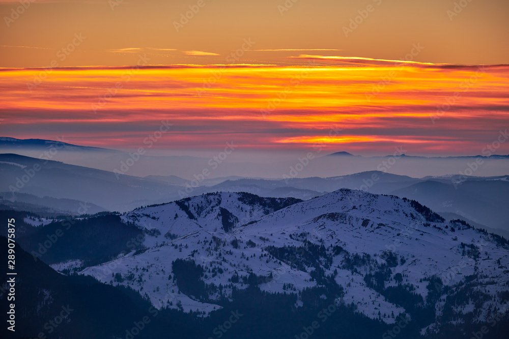 Aerial Landscape view from Ceahlău Mountains National Park at sunset in winter season,Sunset in Ceahlau Mountains