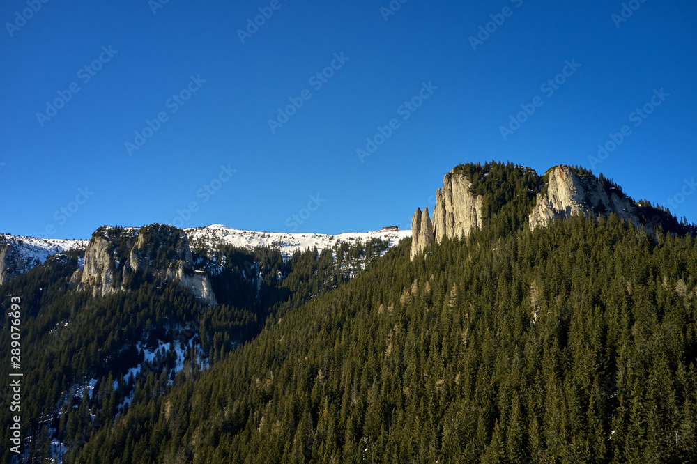 Aerial view of Ceahlau Mountains National Park and Dochia chalet in the winter season Aerial view of Ceahlau Mountains National Park and Dochia chalet in the winter season