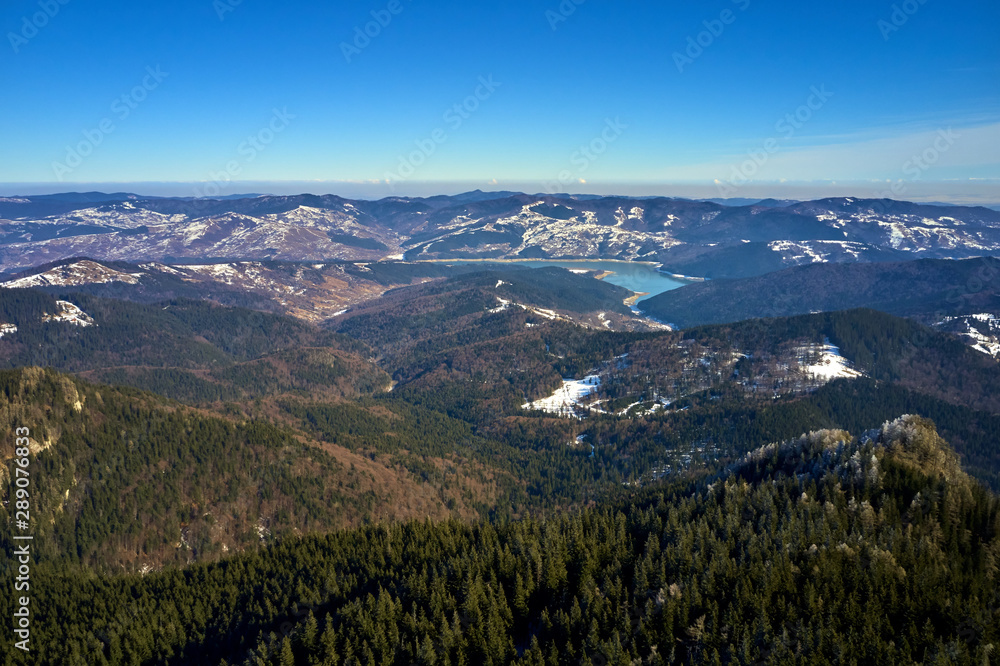 Aerial Landscape view from Ceahlău Mountains National Park at sunrise in winter season