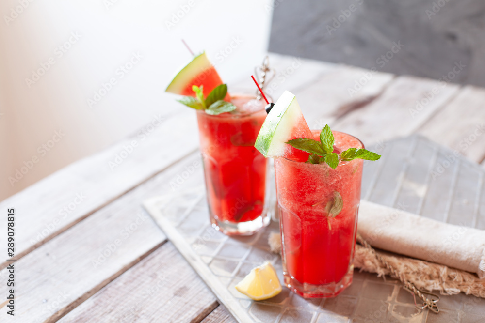 Watermelon drink in glasses with slices of water melon