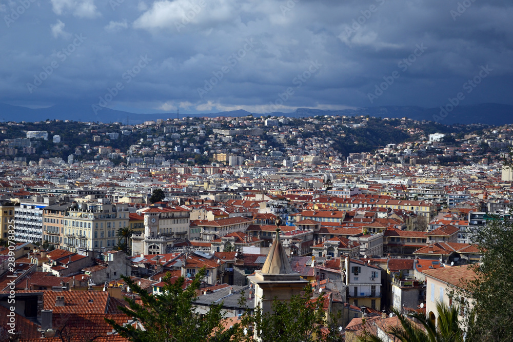 Nice, France - february 11th 2018 : cityscape of Nice during a thunderstorm, with sun