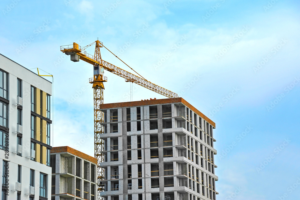 Crane and highrise construction site Crane and highrise construction site