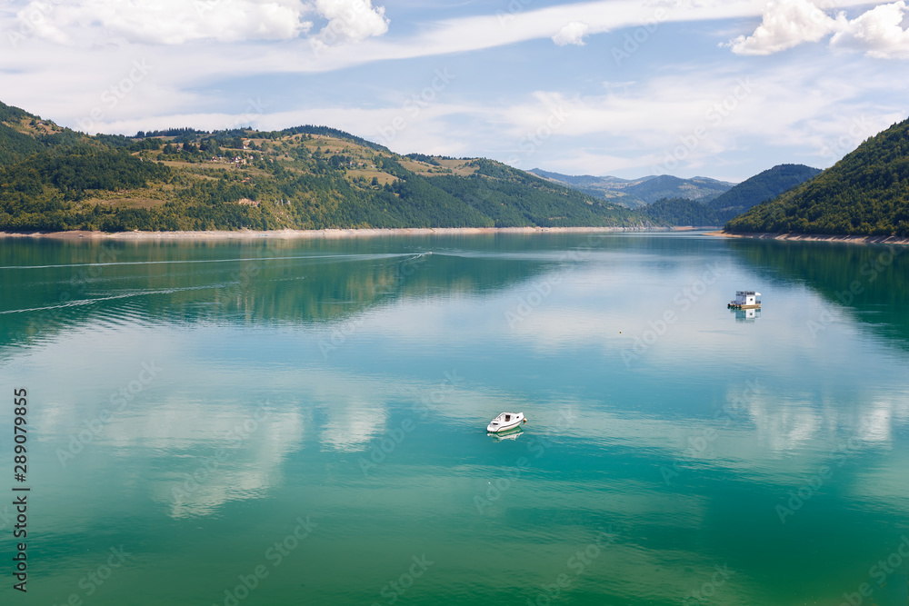 Beautiful Zlatar mountain lake with reflection in late summer,  Serbia