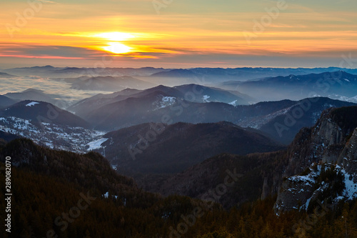 Aerial Landscape view from Ceahlău Mountains National Park at sunset in winter season,Sunset in Ceahlau Mountains