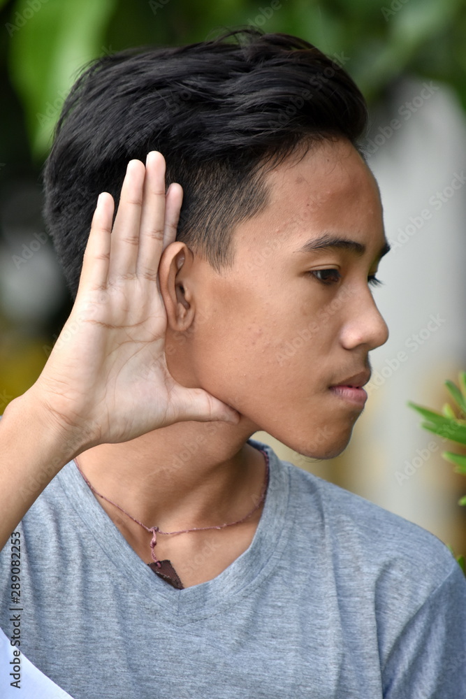 Fototapeta premium An A Teenager Boy Listening