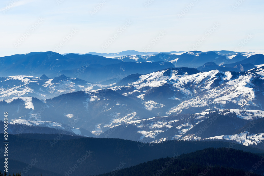 Landscape view from Ceahlău Mountains National Park at sunset in winter season,Sunset in Ceahlau Mountains Landscape view from Ceahlău Mountains National Park at sunset in winter season,Sunset in Ceahlau Mountains