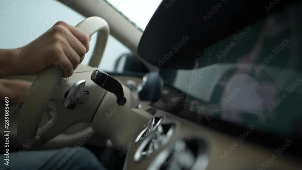 Highway Car Driving During Late Rainy Afternoon. Caucasian Men Behind the Wheel on His Road Trip. Highway Car Driving During Late Rainy Afternoon. Caucasian Men Behind the Wheel on His Road Trip.