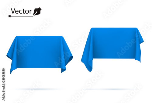 Object covered with blue silk cloth. Box, rectangle. Surprise, award, prize, presentation concept. Reveal a hidden object. 