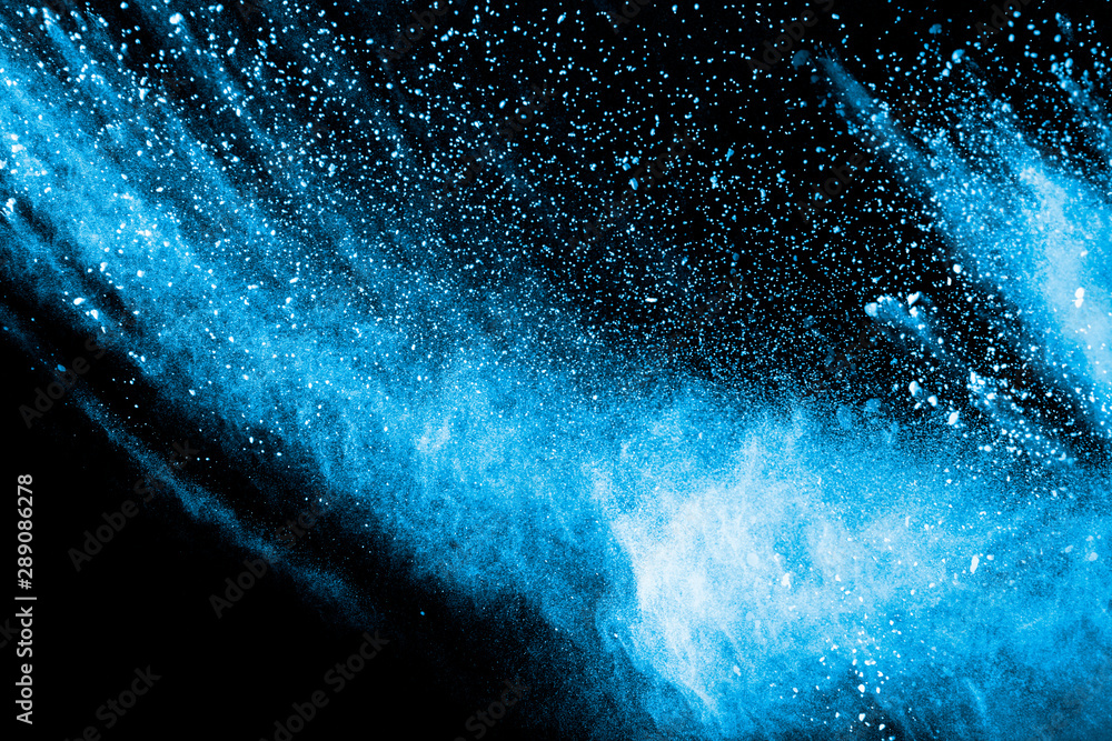 Blue color powder explosion on black background.