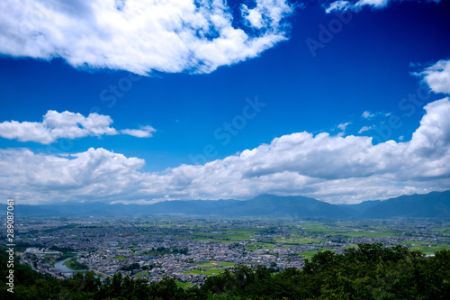 landscape with blue sky and clouds © Tsune