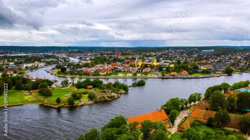 Fredrikstad, Norway. Aerial view of Glomma river in Fredrikstad, Norway with famous landmarks like Isegran Fort. Time-lapse with moving boats and clouds photo