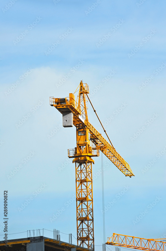 Crane and highrise construction site Crane and highrise construction site
