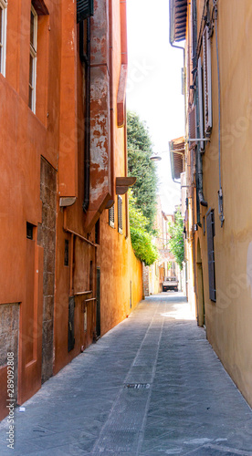 Beauty and narrow street with colorful houses in Pisa,Tuscany, Italy