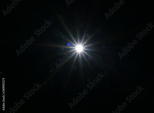 Fototapeta Naklejka Na Ścianę i Meble -  Flash light ray Black background using Layers mode Screen