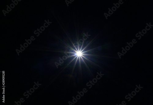 Fototapeta Naklejka Na Ścianę i Meble -  Flash light ray Black background using Layers mode Screen