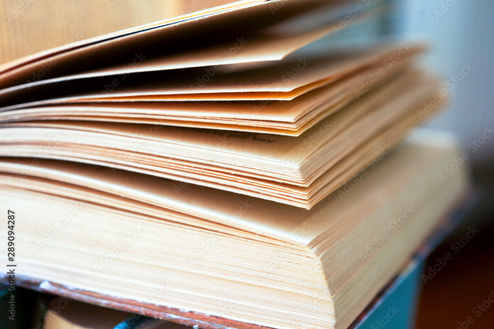 Open book, hardback books on bright colorful background. Open book, hardback books on bright colorful background.