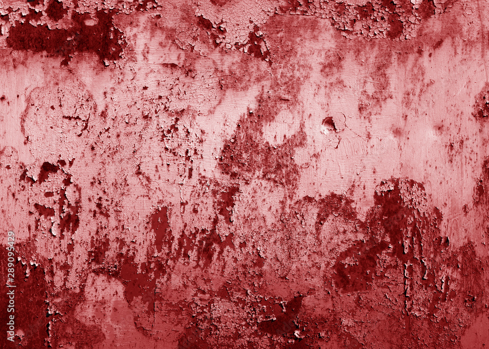 Grungy rusted metal surface in red tone.