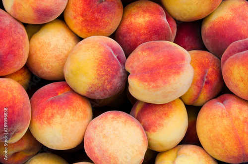 Background of fresh ripe organic peaches