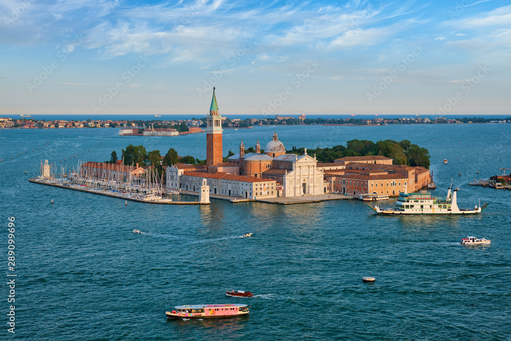 Aerial view of Venice lagoon with boats and San Giorgio di Maggiore church. Venice, Italy
