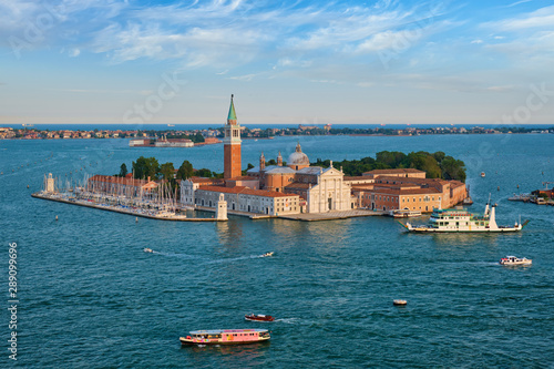 Aerial view of Venice lagoon with boats and San Giorgio di Maggiore church. Venice, Italy