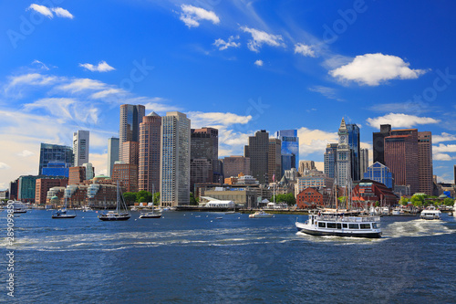 Boston skyline with passenger boat on the foreground, Massachusetts, USA photo