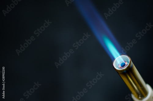 gas flame gun torch blue fire butane white background