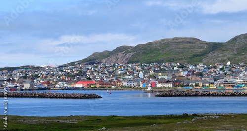 Saint Pierre city panorama, view from the Ile aux Marin past the harbor entrance towards the town of Saint Pierre, Saint Pierre and Miquelon 
