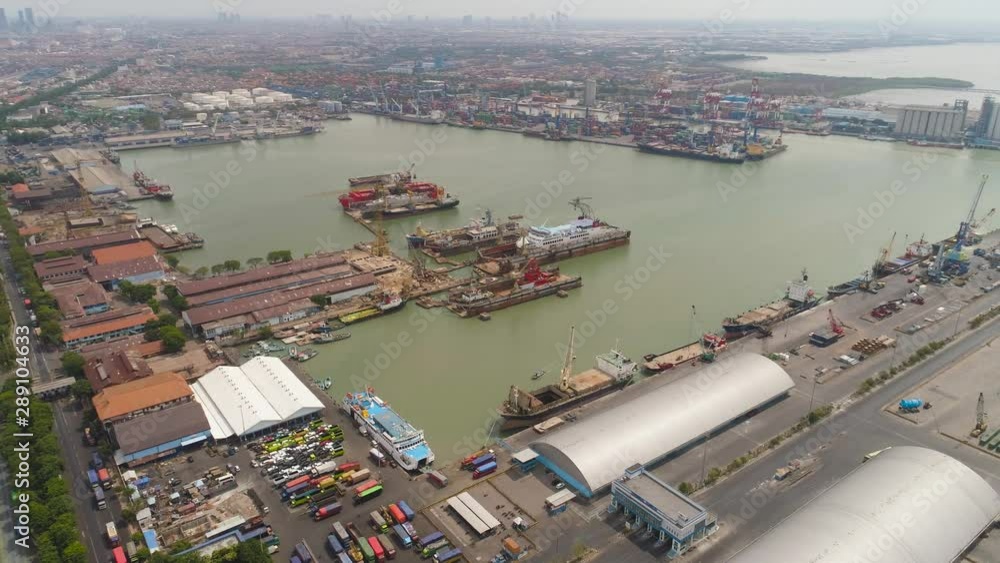 aerial view cargo and passenger seaport with ships and crane Tanjung Perak, surabaya, indonesia. docks for the repair and parking of ships, cargo port and container terminal. ship in industrial port aerial view cargo and passenger seaport with ships and crane Tanjung Perak, surabaya, indonesia. docks for the repair and parking of ships, cargo port and container terminal. ship in industrial port