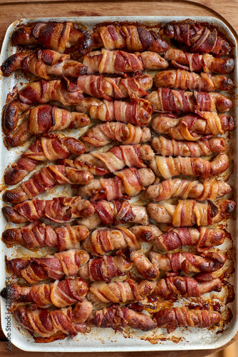 Overhead View of a Tray of Cooked Pigs in Blanket