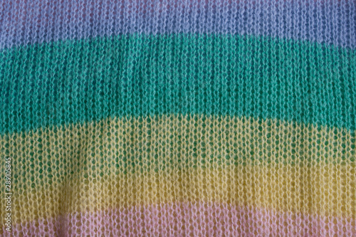 texture of the knitted fabric carpet pastel color. pink,green blue,yellow