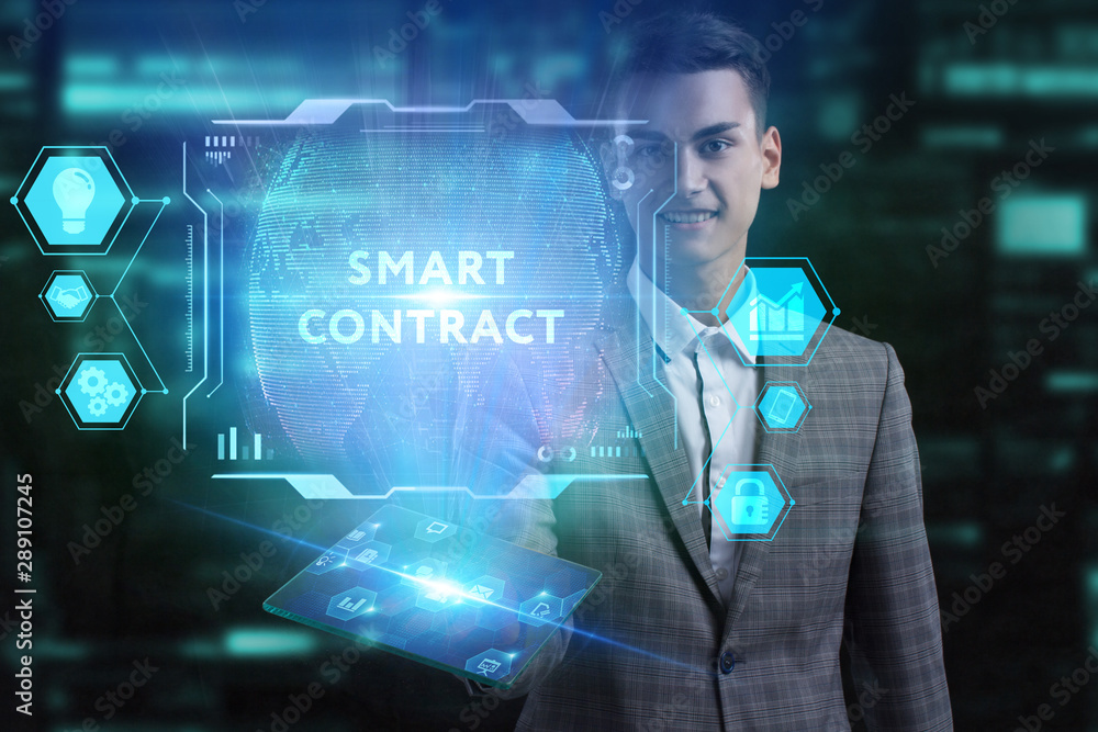 The concept of business, technology, the Internet and the network. A young entrepreneur working on a virtual screen of the future and sees the inscription: Smart contract The concept of business, technology, the Internet and the network. A young entrepreneur working on a virtual screen of the future and sees the inscription: Smart contract