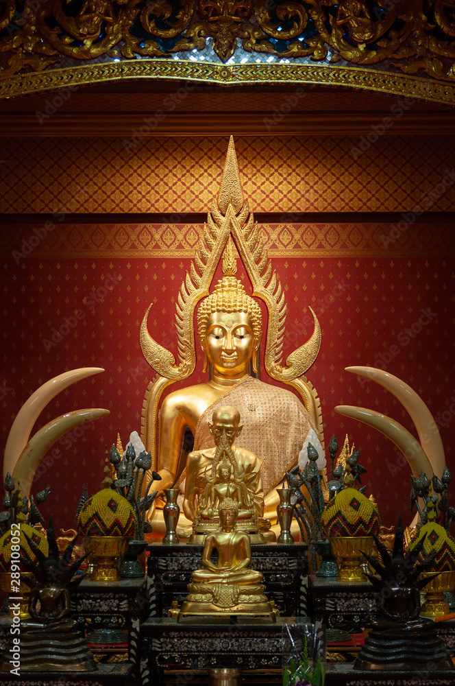 Beautiful golden Buddha sculptures in a temple