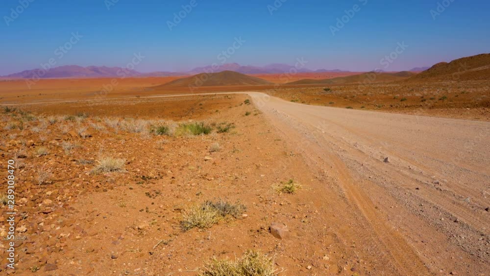 Gravel road in the Namibrand nature reserve in Namibia, Africa. Gravel road in the Namibrand nature reserve in Namibia, Africa.