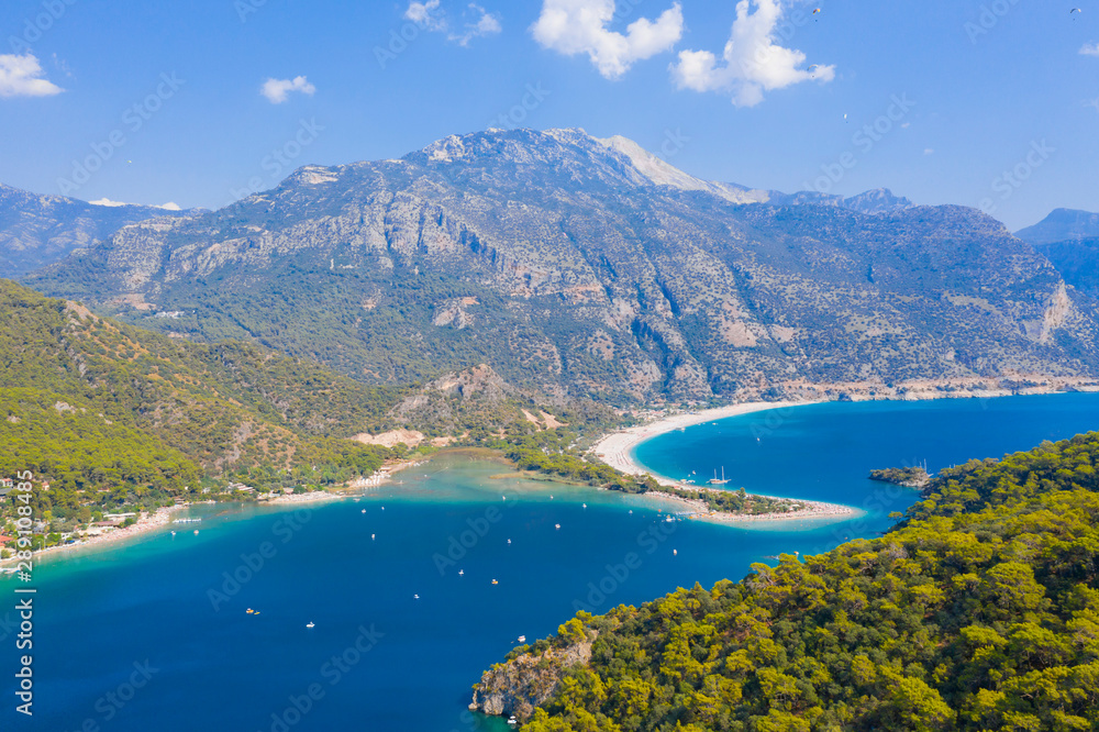 Ölüdeniz is a resort village on the southwest coast of Turkey. It’s known for the blue lagoon of Ölüdeniz Tabiat Parkı and the wide, white Belcekız Beach.	