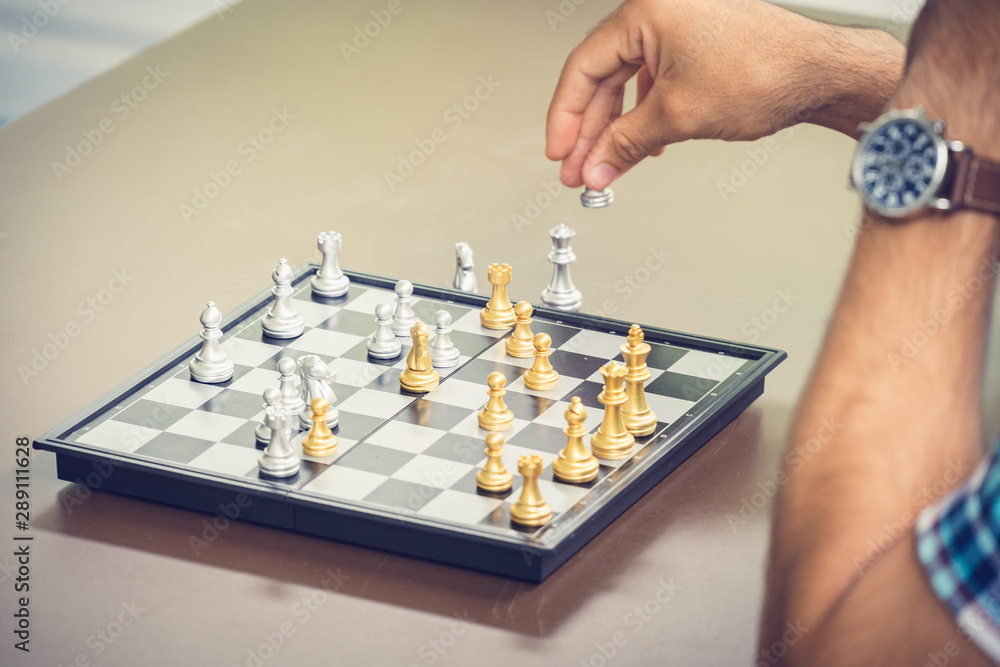 Casual businessman playing chess game with retro style photo, in business competition and planning strategies concept. Casual businessman playing chess game with retro style photo, in business competition and planning strategies concept.