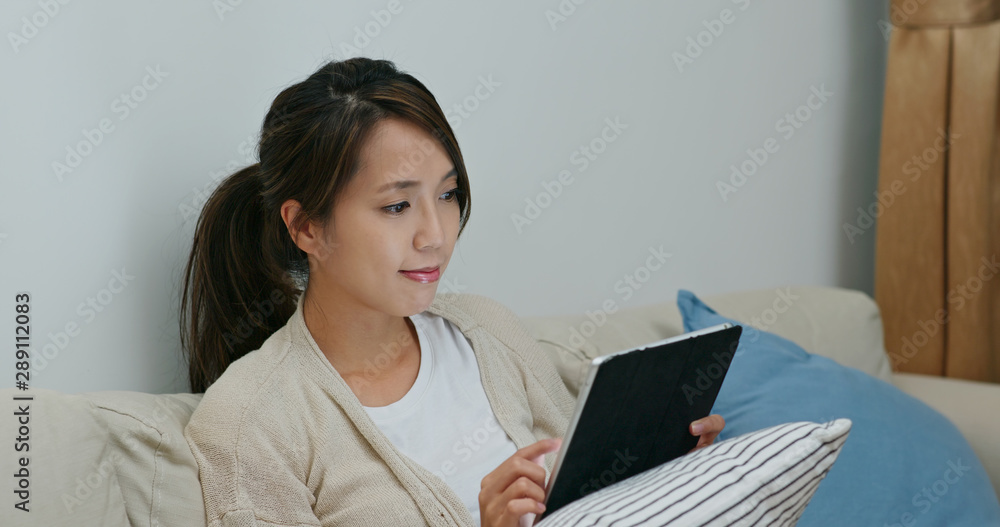 Woman watch on digital tablet computer at home Woman watch on digital tablet computer at home